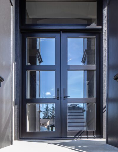 The front door of a building with a glass door.