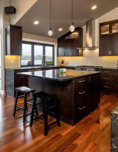 A kitchen with hardwood floors and a center island.