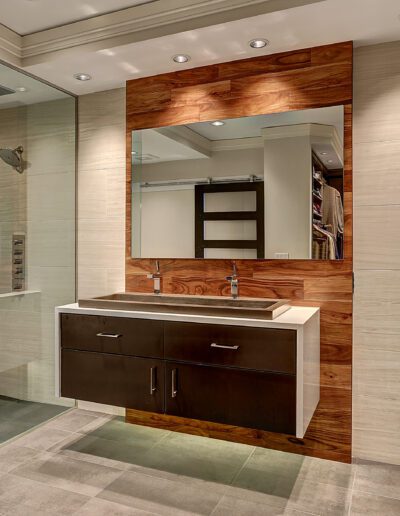 A bathroom with a sink and a shower.